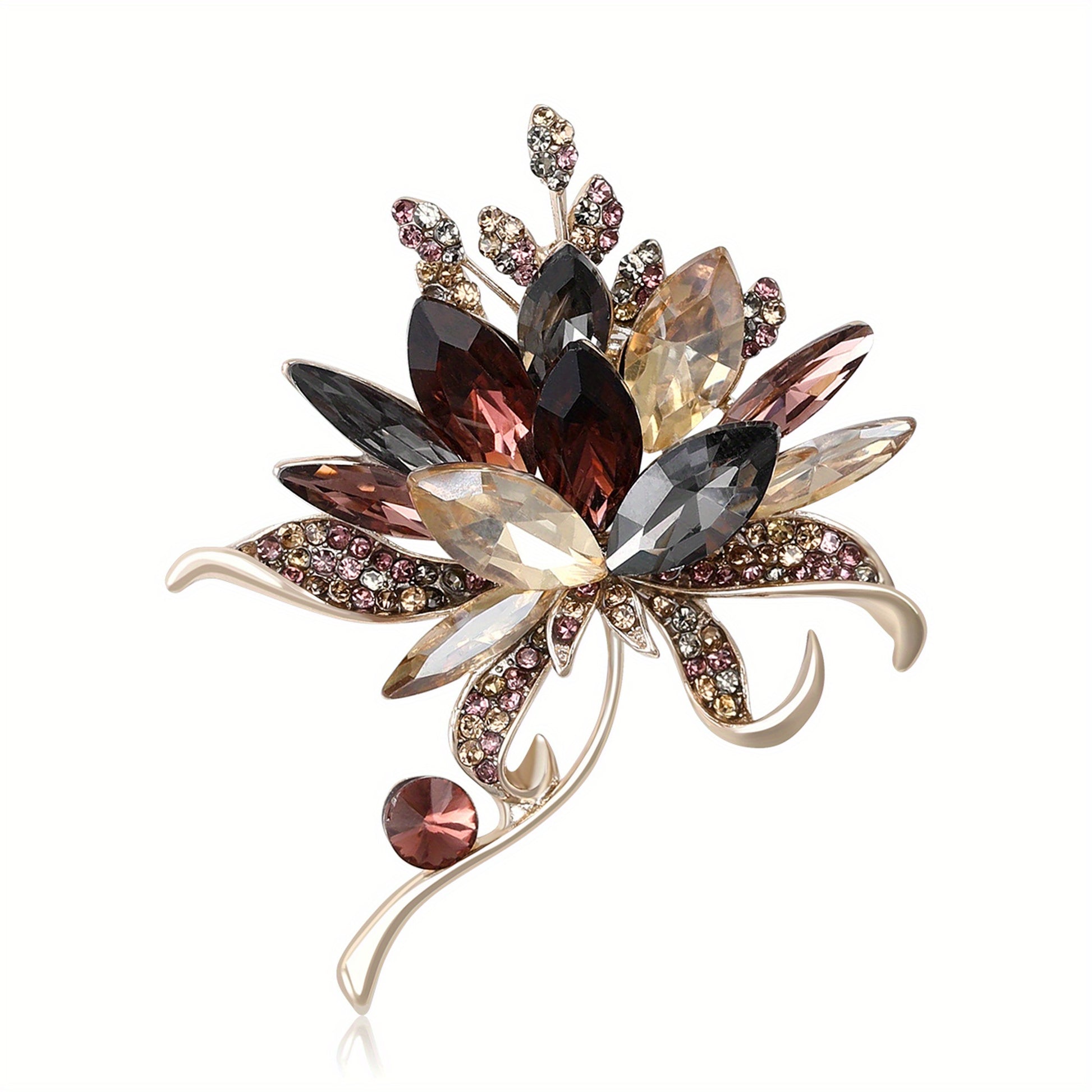 Decorative brooch with multicolored gemstones on a white background