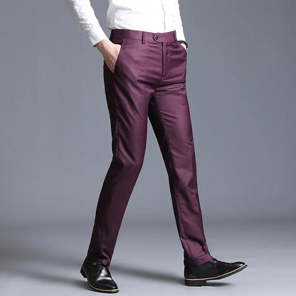 Purple pants worn by a person on a gray background