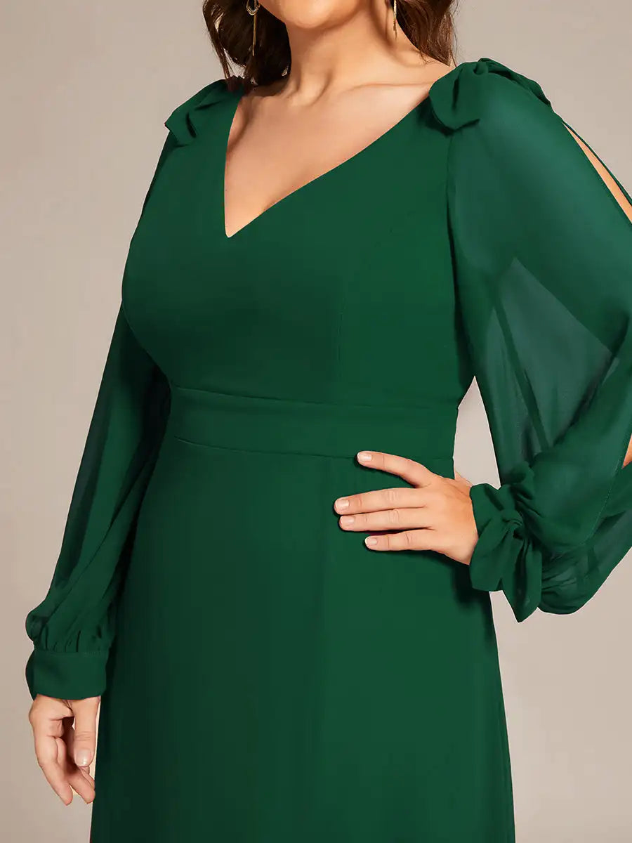 Green dress with long sleeves on a neutral background