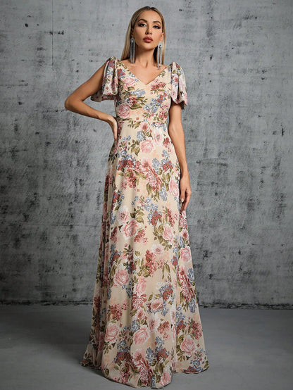 Woman wearing a floral dress against a textured gray wall