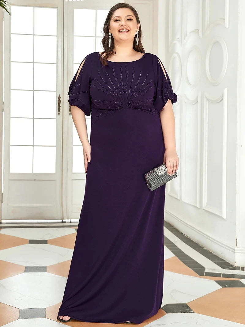 Woman in a long purple dress holding a clutch in an elegant interior setting