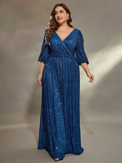 Woman wearing a blue sequin dress against a neutral background