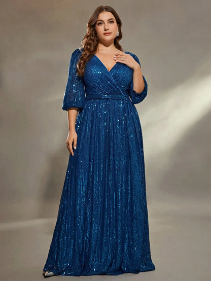 Woman wearing a blue sequin dress against a neutral background
