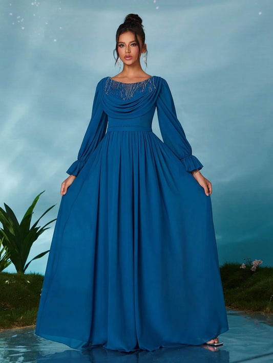 Woman wearing a blue evening gown with a scenic background