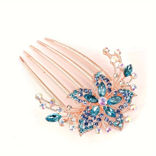 Decorative hair comb with blue gemstones on a white background