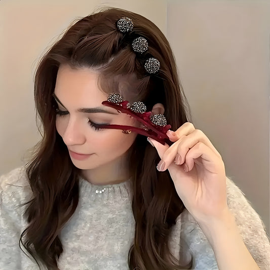 Woman styling her hair with decorative hair clips and a comb.