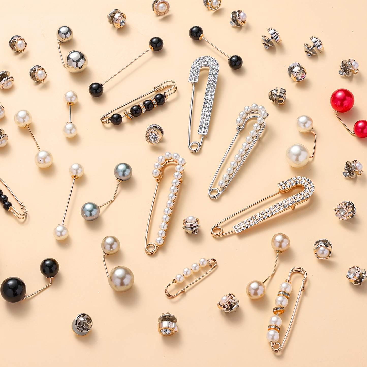 Various brooches with different designs and colors on a beige background