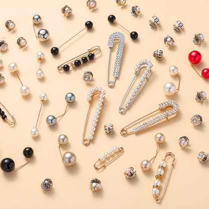 Various brooches with different designs and colors on a beige background